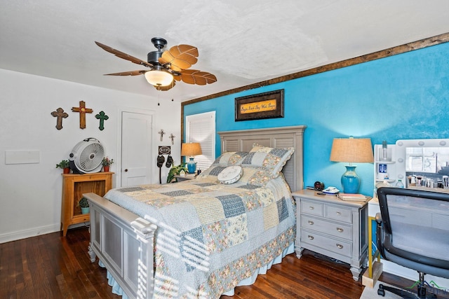 bedroom featuring dark hardwood / wood-style floors and ceiling fan