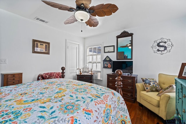 bedroom featuring dark hardwood / wood-style flooring and ceiling fan