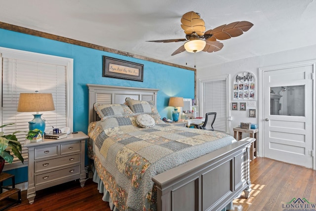 bedroom with dark wood-type flooring and ceiling fan