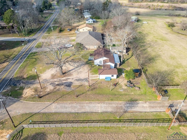 birds eye view of property with a rural view