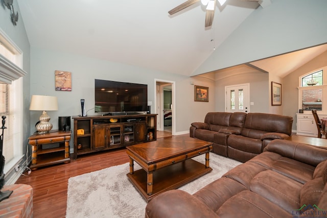 living room with hardwood / wood-style flooring, vaulted ceiling, and ceiling fan