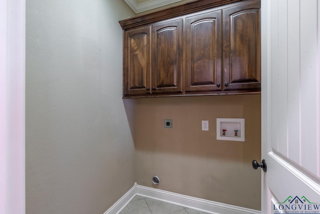 laundry area with hookup for a washing machine, baseboards, cabinet space, electric dryer hookup, and tile patterned floors