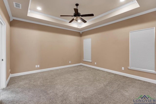 carpeted spare room featuring a tray ceiling, recessed lighting, a ceiling fan, and visible vents