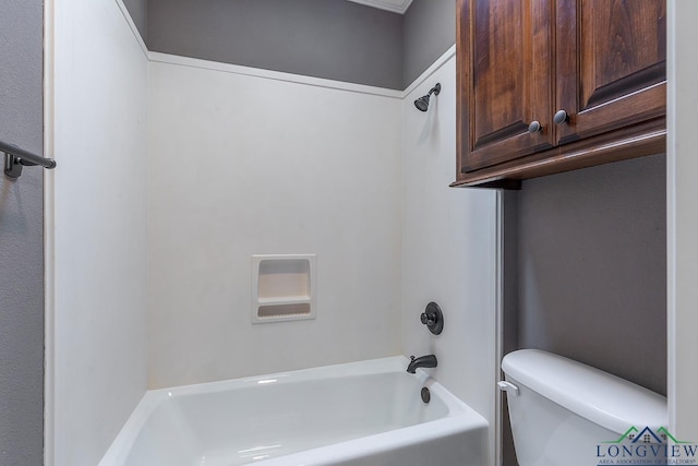 bathroom featuring bathtub / shower combination and toilet