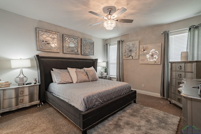 bedroom featuring dark carpet and ceiling fan