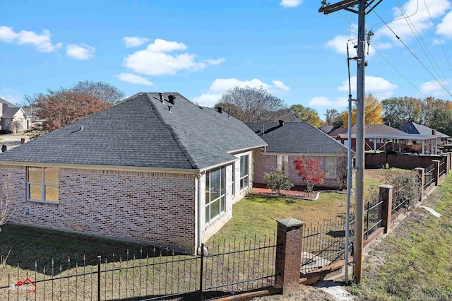 view of property exterior with a yard