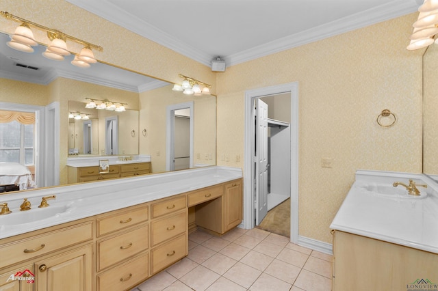 bathroom featuring tile patterned flooring, vanity, and crown molding