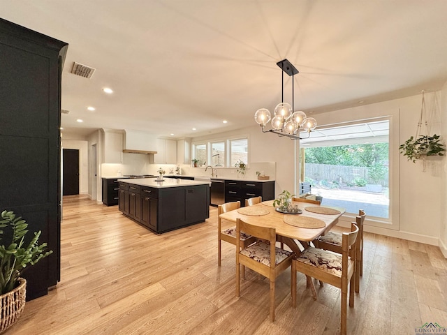 3 Lindsey Ln, Longview, TX 75601 - dining room featuring light wood-style floors, a chandelier, and recessed lighting