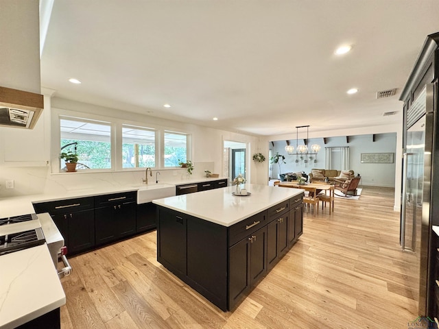 3 Lindsey Ln, Longview, TX 75601 - kitchen featuring dark cabinets, a center island, recessed lighting, light wood finished floors, and dishwasher