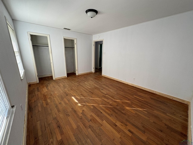 unfurnished bedroom featuring hardwood / wood-style floors