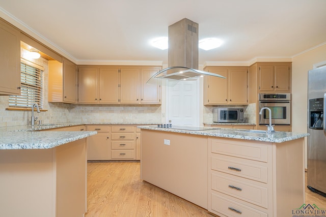 kitchen featuring island range hood, stainless steel appliances, sink, and a kitchen island