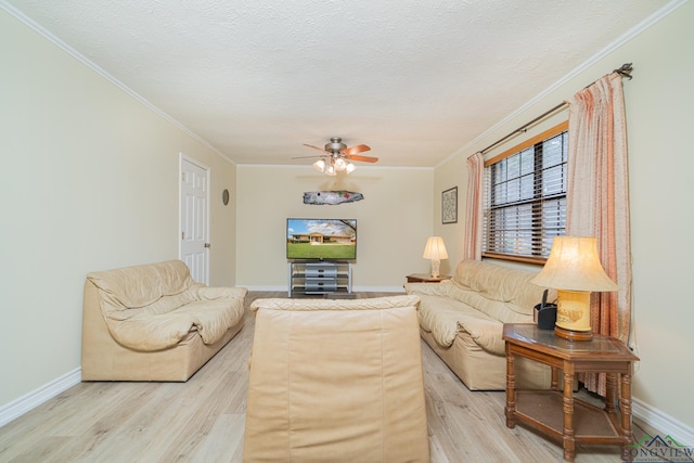 living room with crown molding, hardwood / wood-style floors, and a textured ceiling