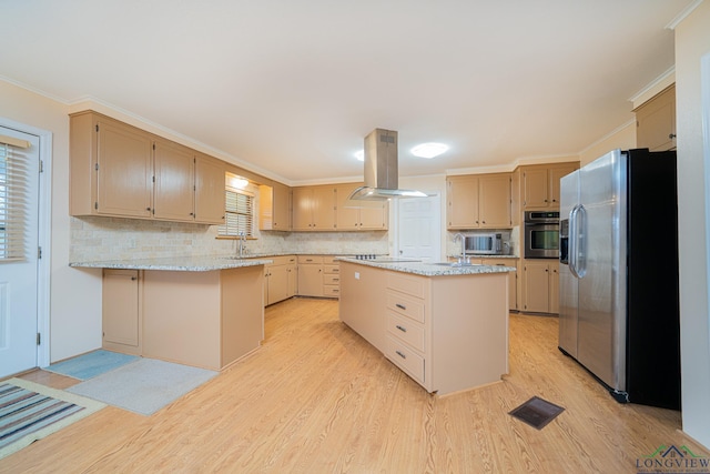 kitchen featuring sink, a center island, light hardwood / wood-style flooring, island exhaust hood, and stainless steel appliances