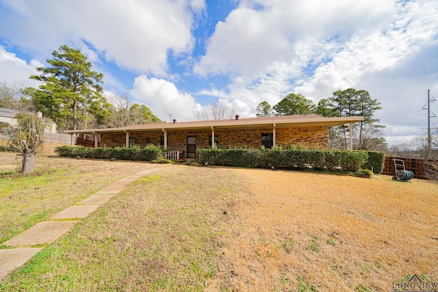 ranch-style home with a front yard