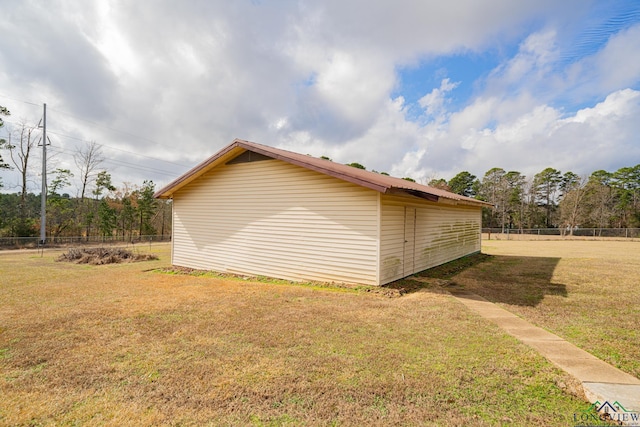 view of property exterior with a yard