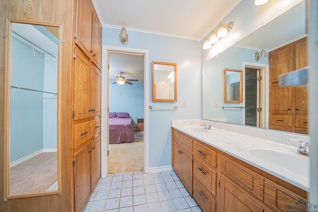 bathroom featuring crown molding, ceiling fan, vanity, and tile patterned flooring