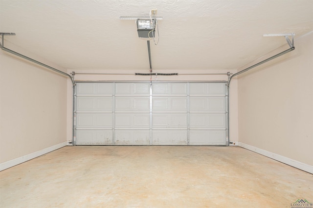1700 Van Zandt Ave, Marshall, TX 75670 - garage featuring a garage door opener and baseboards