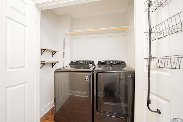 1700 Van Zandt Ave, Marshall, TX 75670 - laundry area with independent washer and dryer and wood finished floors