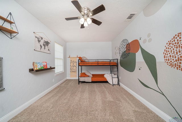 1700 Van Zandt Ave, Marshall, TX 75670 - carpeted bedroom with baseboards and ceiling fan