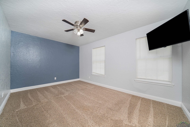 1700 Van Zandt Ave, Marshall, TX 75670 - carpeted empty room with ceiling fan and a textured ceiling