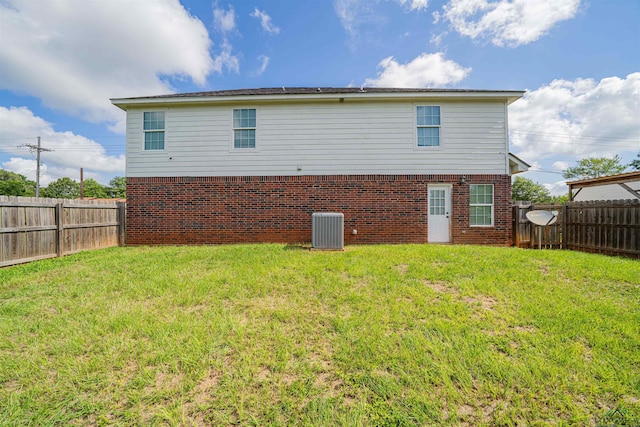 1700 Van Zandt Ave, Marshall, TX 75670 - rear view of property with a fenced backyard and brick siding