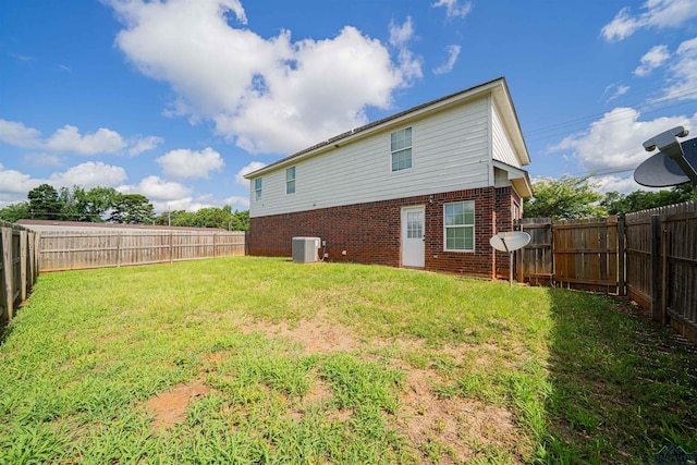 1700 Van Zandt Ave, Marshall, TX 75670 - rear view of property featuring brick siding and a fenced backyard