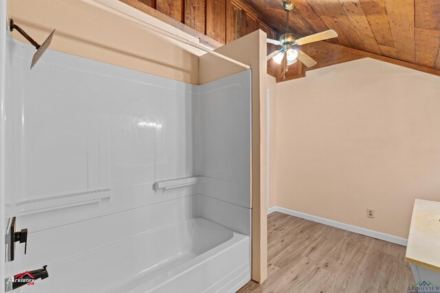 154 County Rd 117, Carthage, TX 75633 - bathroom with wood ceiling, ceiling fan, wood finished floors, bathing tub / shower combination, and vaulted ceiling