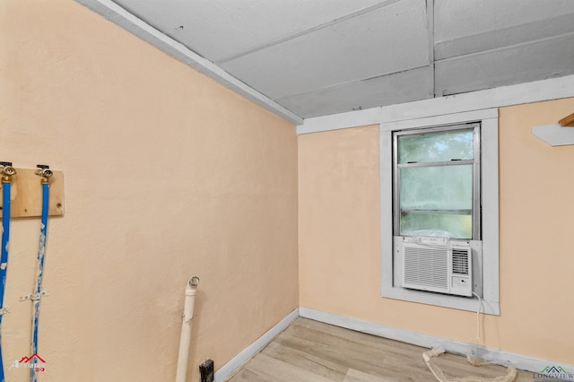 154 County Rd 117, Carthage, TX 75633 - unfurnished room featuring wood finished floors and cooling unit