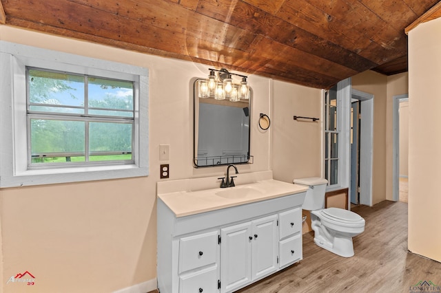 154 County Rd 117, Carthage, TX 75633 - bathroom featuring wooden ceiling, vanity, wood finished floors, and a chandelier