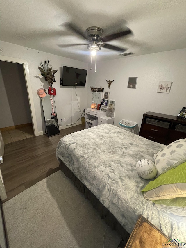 bedroom featuring ceiling fan and wood-type flooring