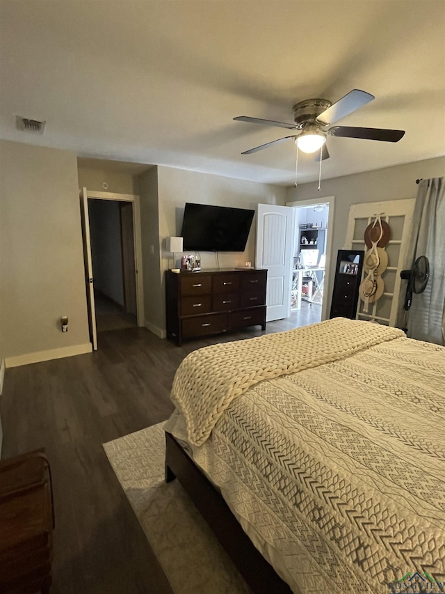 bedroom featuring ceiling fan and dark hardwood / wood-style floors