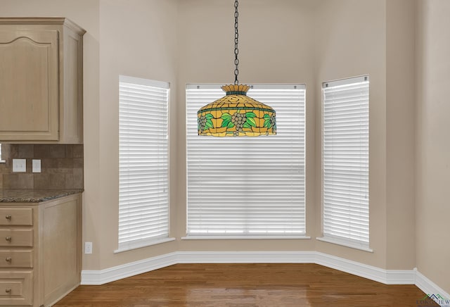 unfurnished dining area with hardwood / wood-style floors