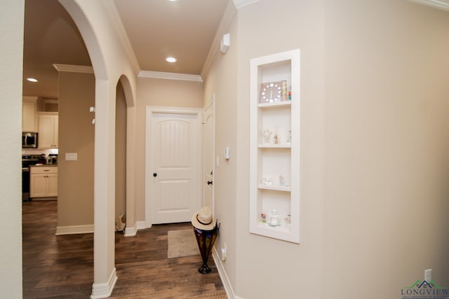 2131 Page Creek Trl, Longview, TX 75601 - hallway featuring arched walkways, built in shelves, crown molding, dark wood-style floors, and recessed lighting