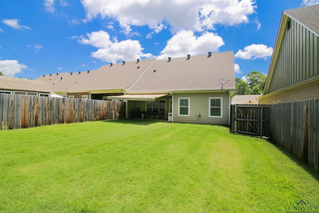 2131 Page Creek Trl, Longview, TX 75601 - rear view of property with a fenced backyard and a shingled roof