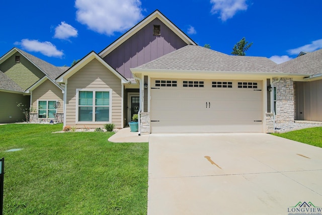 2131 Page Creek Trl, Longview, TX 75601 - view of front facade with board and batten siding, an attached garage, a front yard, concrete driveway, and stone siding