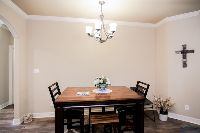 2131 Page Creek Trl, Longview, TX 75601 - dining area with arched walkways, a chandelier, ornamental molding, and dark wood finished floors
