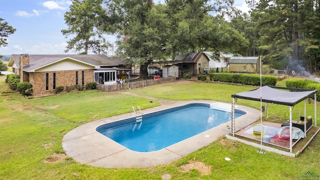 view of swimming pool with a patio and a lawn