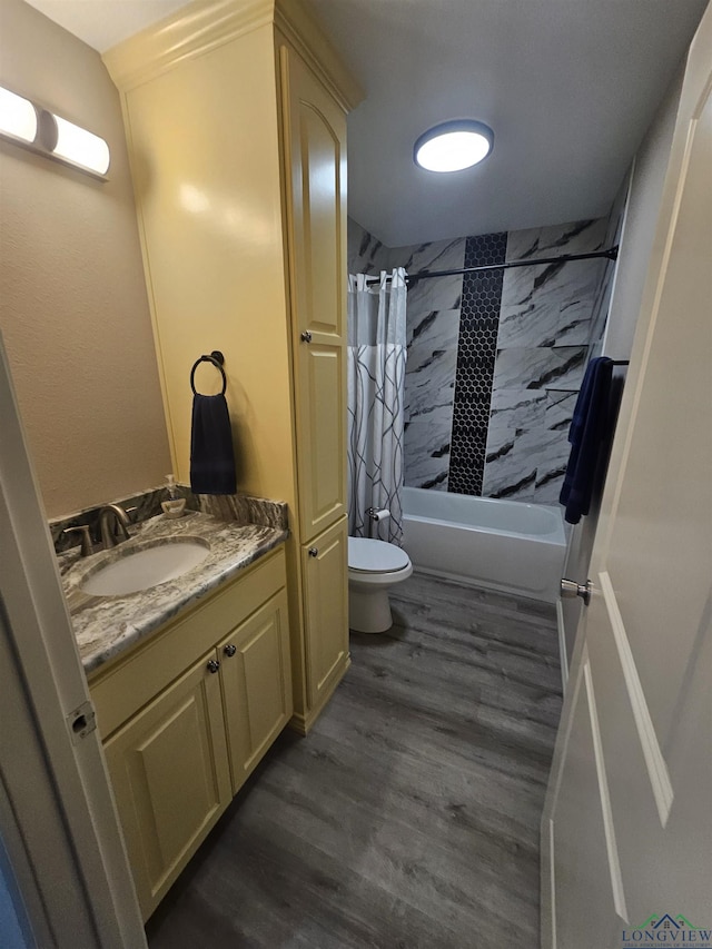 full bathroom featuring hardwood / wood-style flooring, vanity, toilet, and shower / bath combo with shower curtain