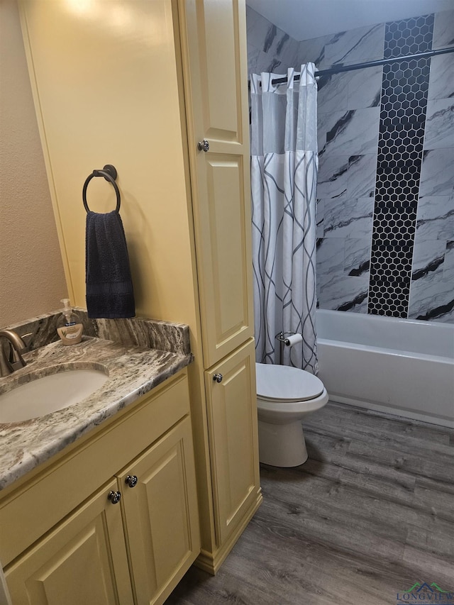 full bathroom featuring shower / bath combination with curtain, toilet, wood-type flooring, and vanity