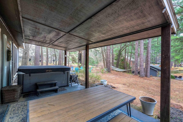 wooden terrace with a hot tub