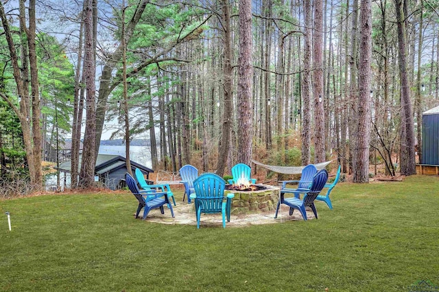 view of yard with a fire pit