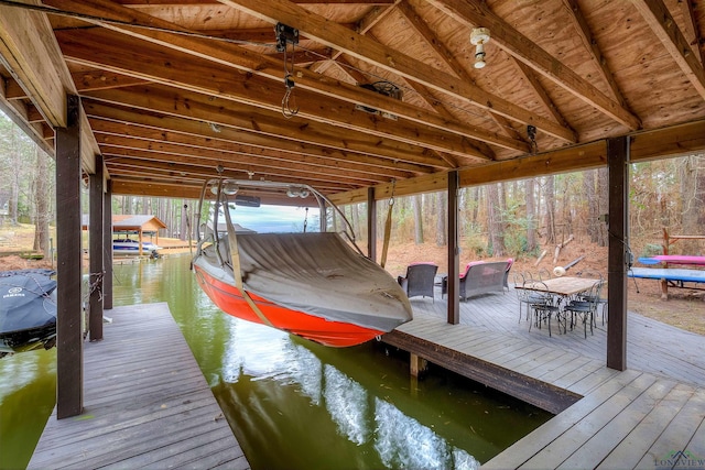 dock area featuring a water view and boat lift