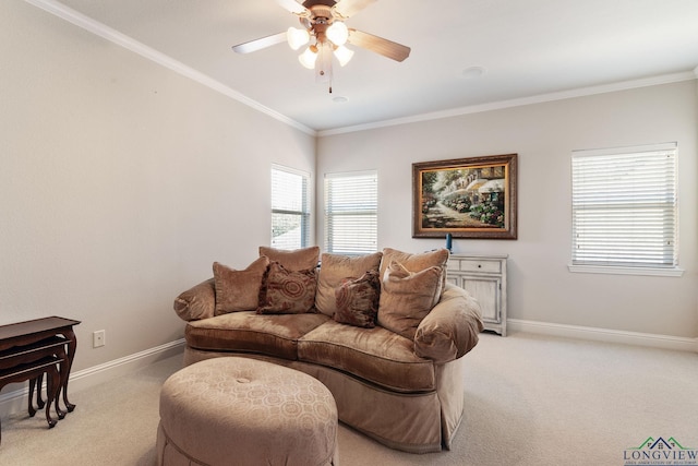 carpeted living room featuring ornamental molding and ceiling fan