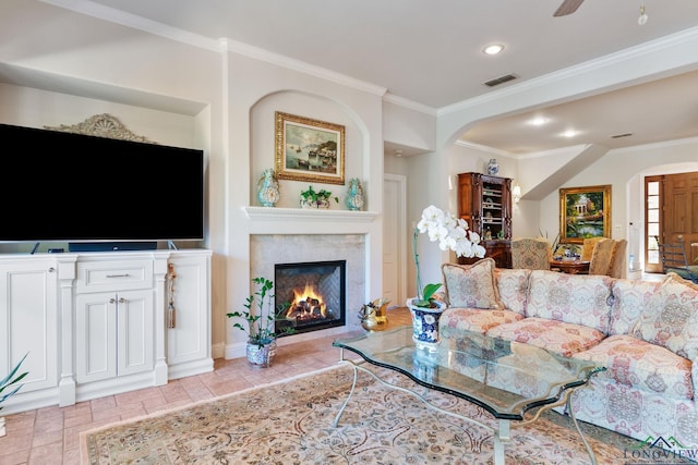 living room featuring crown molding and ceiling fan