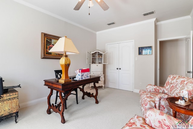 carpeted office with crown molding and ceiling fan