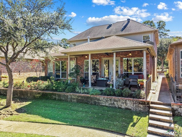 rear view of house featuring ceiling fan, a yard, an outdoor hangout area, and a patio