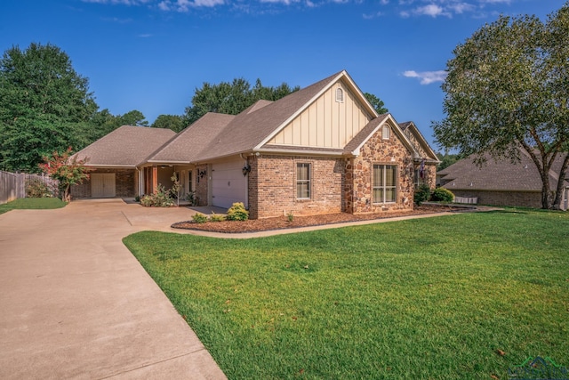 view of front facade featuring brick siding, a garage, board and batten siding, a front yard, and concrete driveway