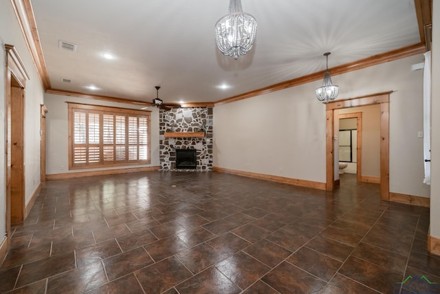 unfurnished living room featuring crown molding, baseboards, ceiling fan with notable chandelier, and a stone fireplace