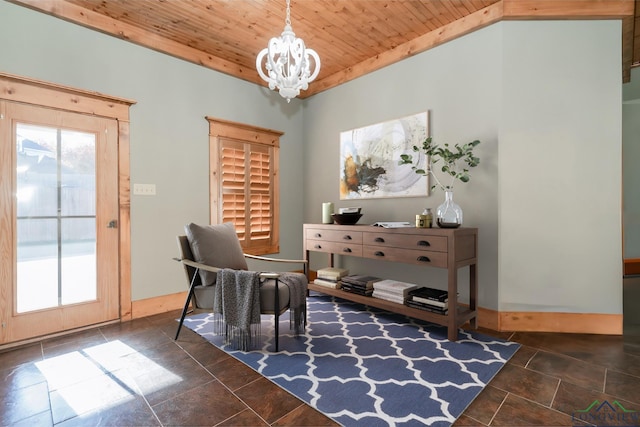 sitting room featuring stone finish flooring, an inviting chandelier, plenty of natural light, and wood ceiling