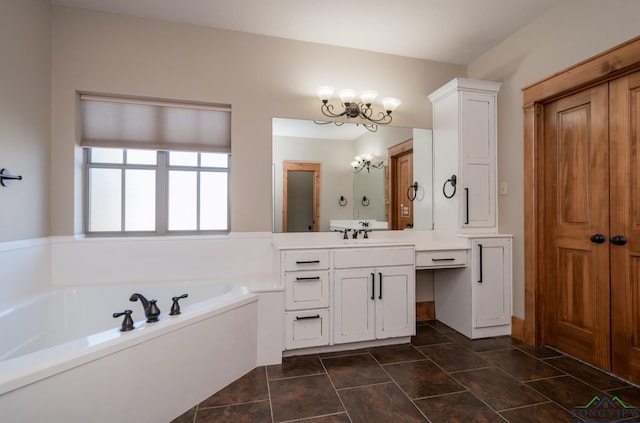 full bath with an inviting chandelier, a garden tub, and vanity